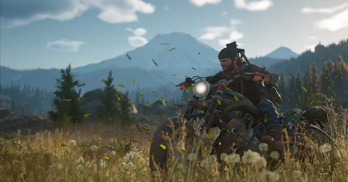 Deacon St. John fährt mit seinem stark modifizierten Drifter-Bike durch einen üppigen, aber gefährlichen Wald im pazifischen Nordwesten in Days Gone.