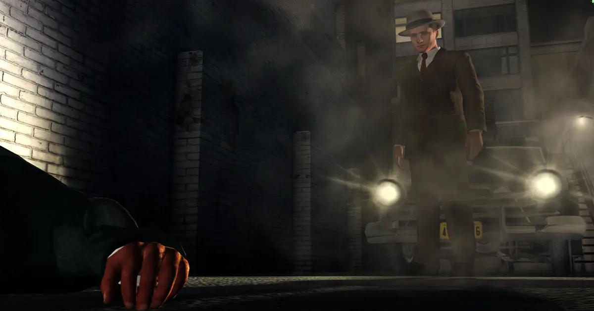 L.A. Noire Detektiv Cole Phelps steht in einer schwach beleuchteten Straße der 1940er Jahre