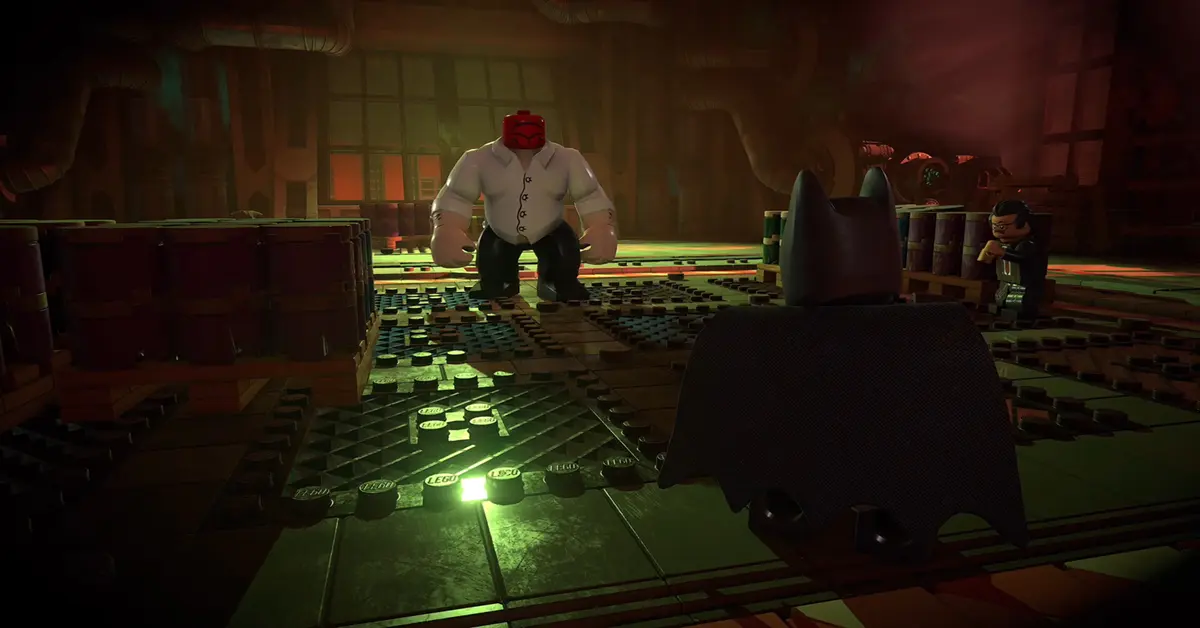 Batman führt einen Konterangriff gegen einen Straßenschläger in LEGO Batman Legacy of the Dark Knight aus