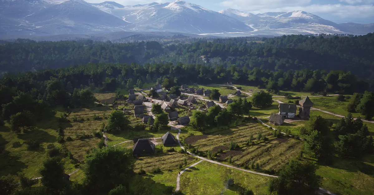 Nahaufnahme eines Herrenhauses und der umliegenden Felder in Manor Lords.