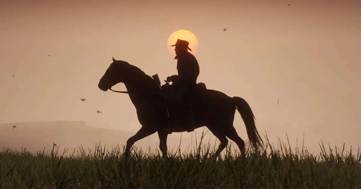 Arthur Morgan auf einem Pferd während eines Sonnenuntergangs in Red Dead Redemption 2.